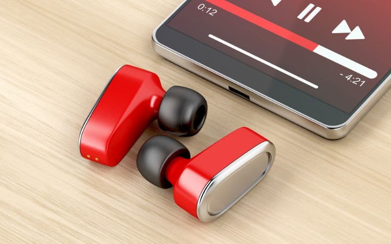 Red earbuds and smartphone