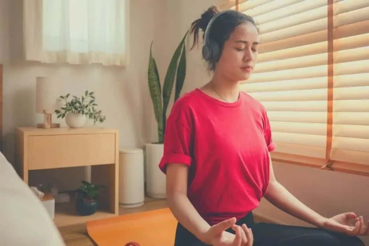Meditating with headphones on