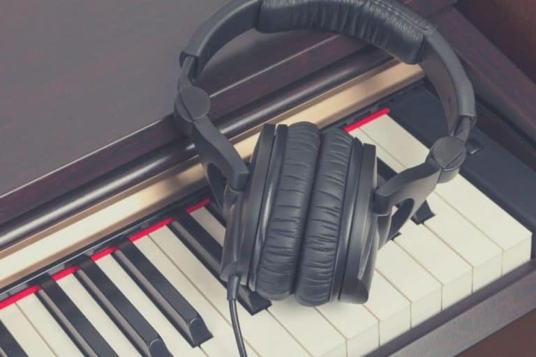 Over ear headphones on digital piano
