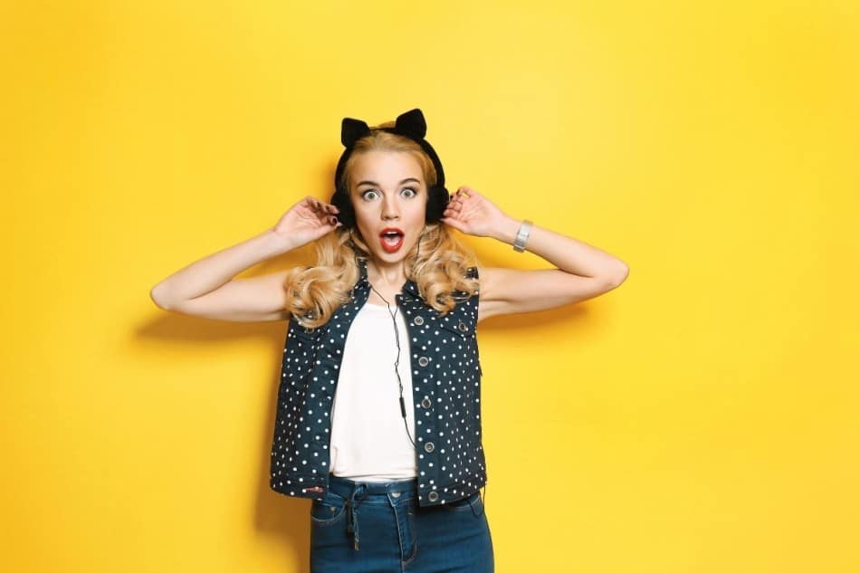 Woman listening to music with cat ear headphones